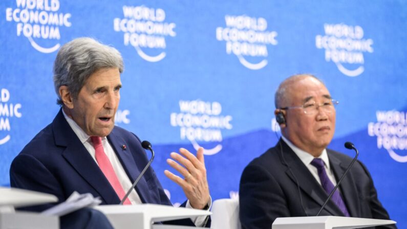 US climate envoy John Kerry (L) gestures as he speaks next to China's special climate envoy Xie Zhenhua (R) during a session at the World Economic Forum annual meeting in Davos on May 24, 2022. (Photo by Fabrice COFFRINI / AFP) (Photo by FABRICE COFFRINI/AFP via Getty Images)