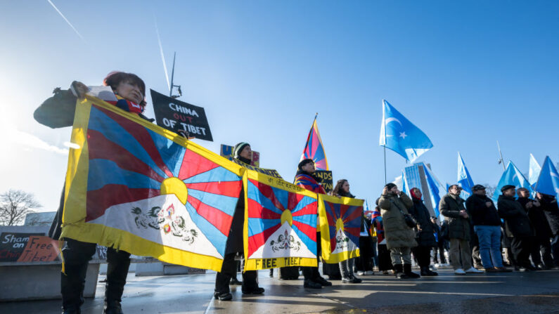 Tibetan and Uyghur activist stage a protest outside of the UN Offices at Geneva during the review of China's rights record by the United Nations Human Rights Council, on January 23, 2024. China faced stinging criticism from Western countries during a review of its rights record at the United Nations but it was also lauded by many countries including India and Eritrea. Beijing was facing a regular Universal Periodic Review (UPR) -- an examination all 193 UN member states must undergo every four to five years to assess their human rights record. (Photo by Fabrice COFFRINI / AFP) (Photo by FABRICE COFFRINI/AFP via Getty Images)