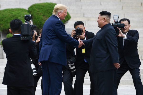 Trump and Ki shake hands
