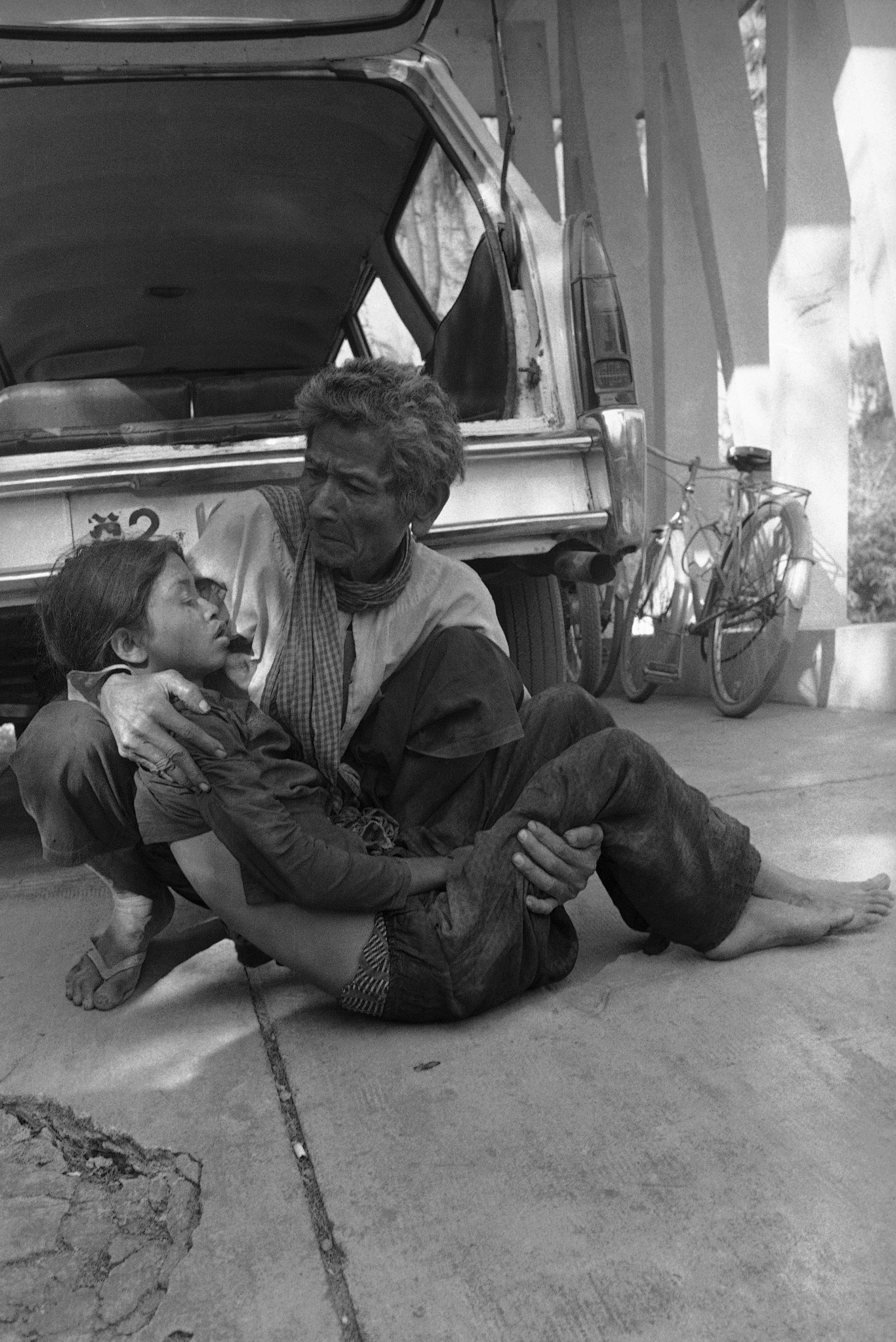 A Cambodian cries as he holds his dead daughter killed when Khmer Rouge insurgents sheiled Prek Phnau, eight miles North of Phnom Penh in Cambodia an. 10, 1974. (AP Photo/Chor Yuthy)